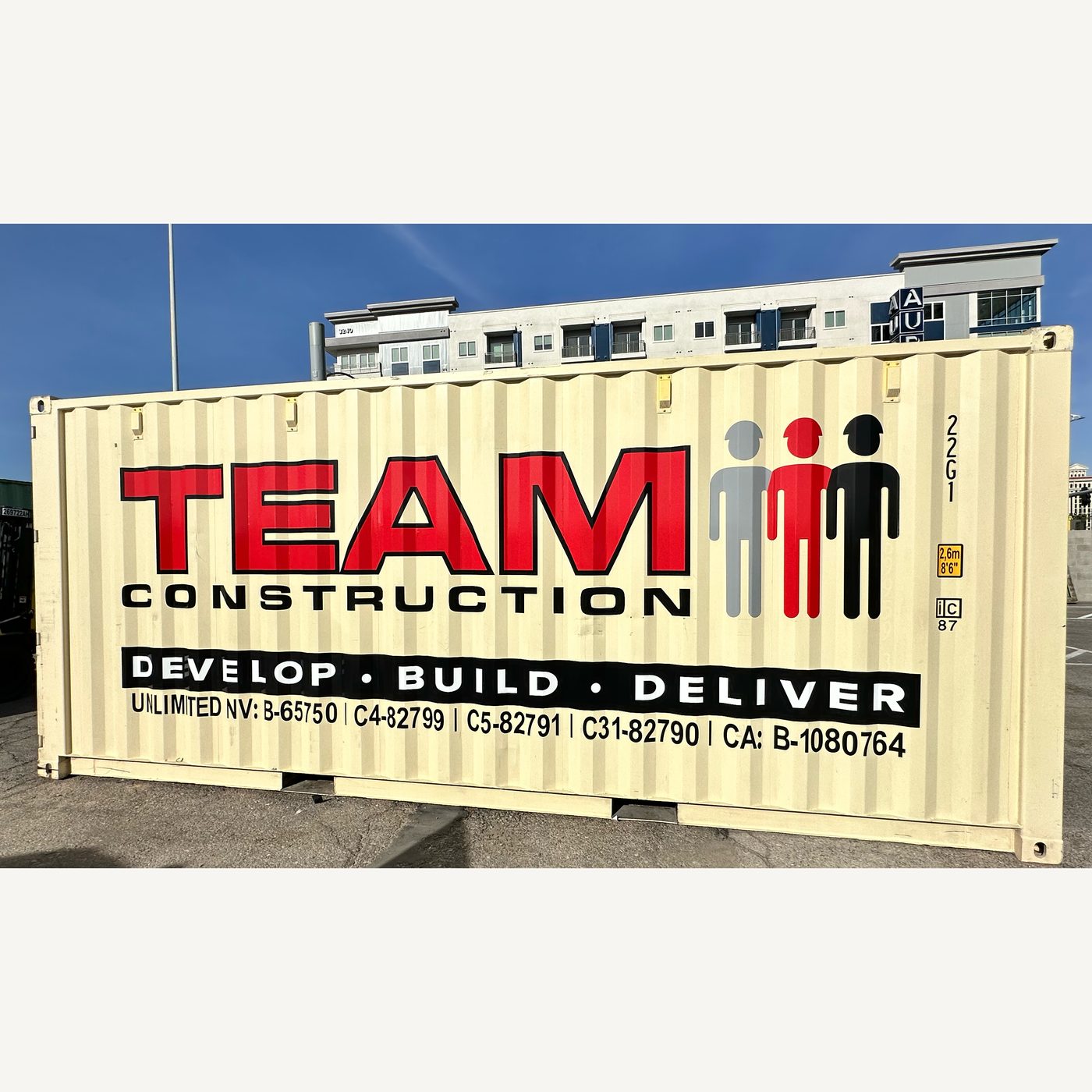 Real photo: the same lettering layout on a cream 20 ft container in a yard (product photo 3 of 4)