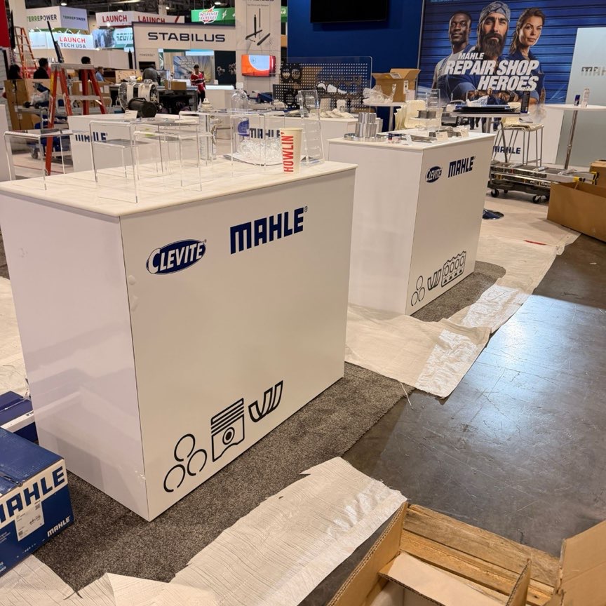 Real photo: matching counter graphics across a booth, with other booths going up behind (product photo 3 of 3)