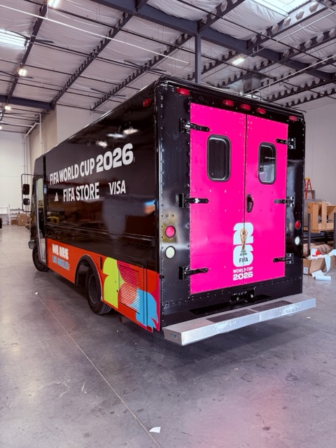 Box truck with a full black and pink World Cup 2026 store wrap, installed by Wrap It! Innovative Installs